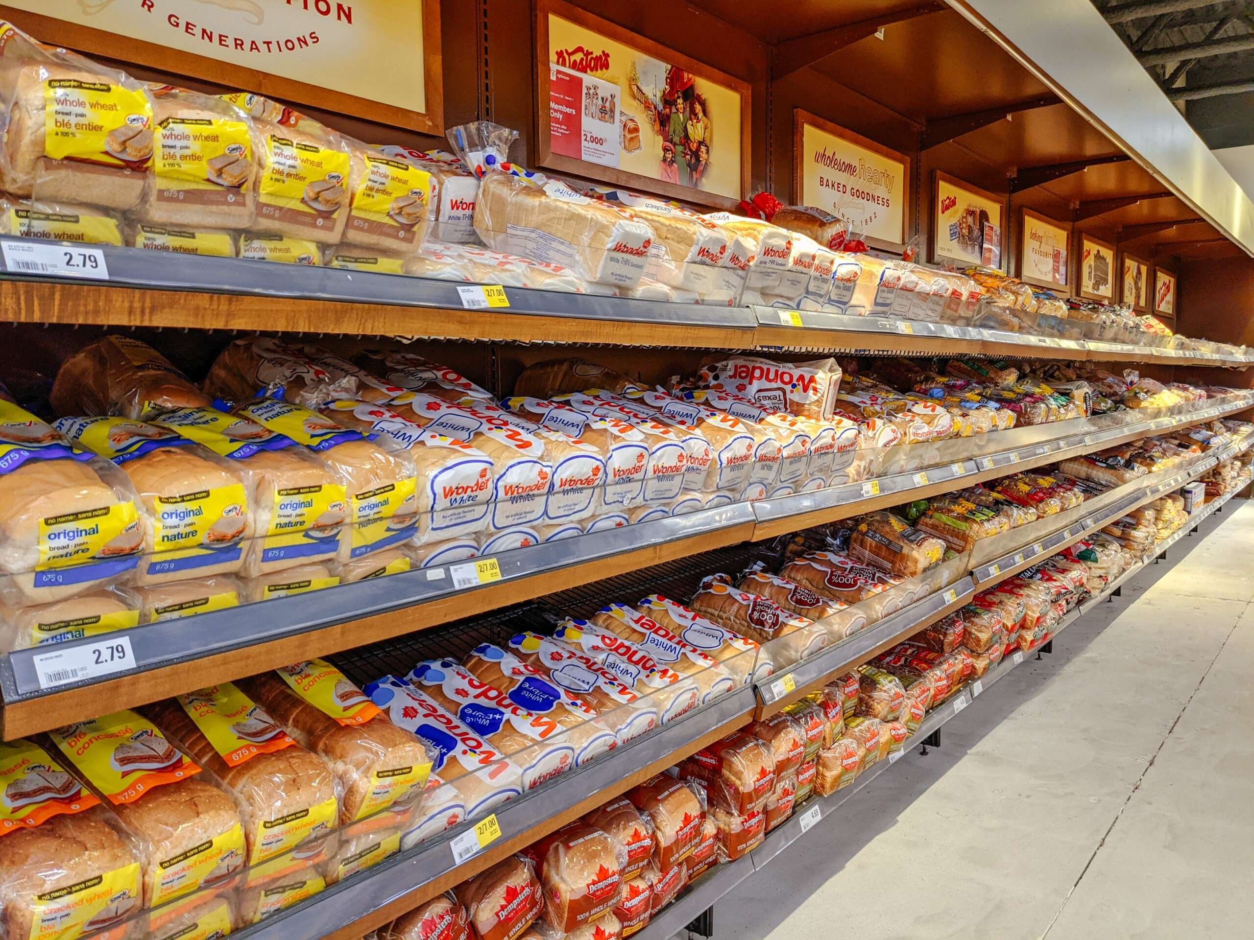 A store aisle displaying various packaged breads.